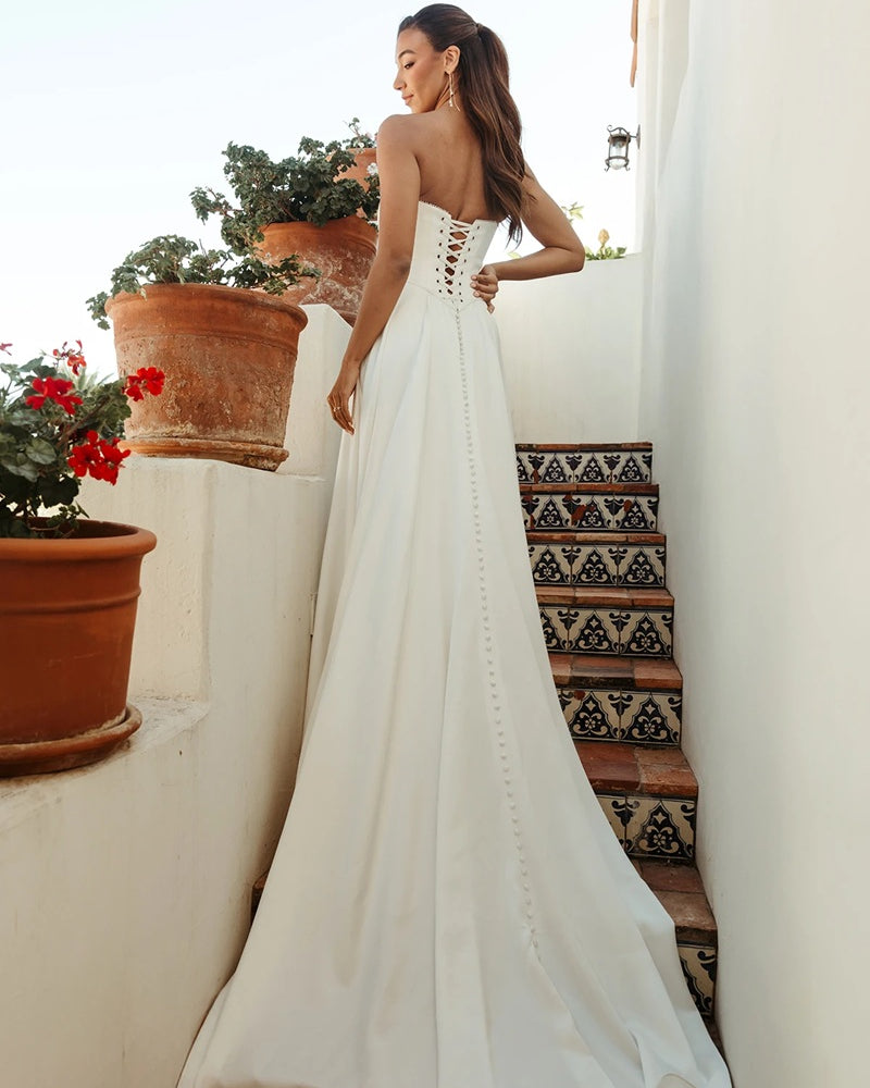 Strapless bridal gown with lace up back.