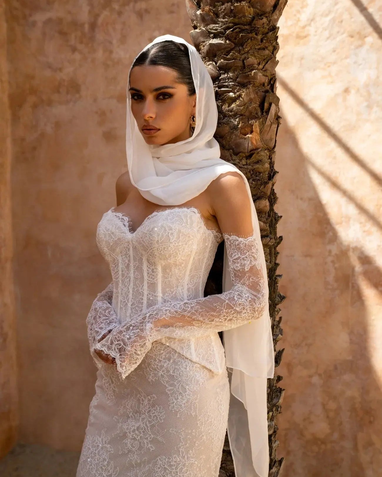 Amani two-piece lace bridal gown with mesh corset top, sweetheart neckline and fit-and-flare lace skirt.