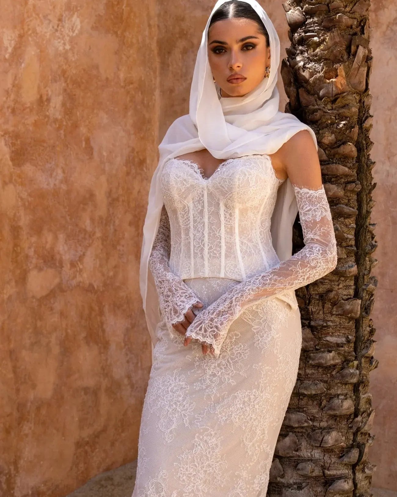 Wide front view of Amani two-piece lace bridal gown with structured corset bodice, sweetheart neckline, and fit-and-flare lace skirt. With Chiffon Scarf.