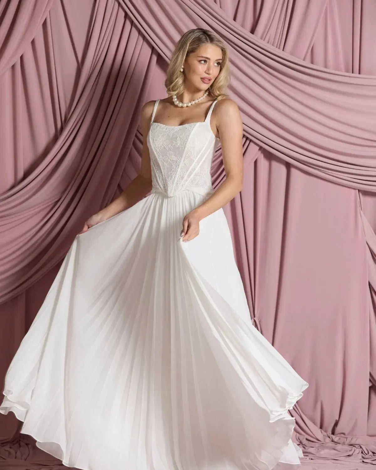Front view of Larissa pleated chiffon bridal skirt in A-line silhouette, flowing gracefully from the waist.