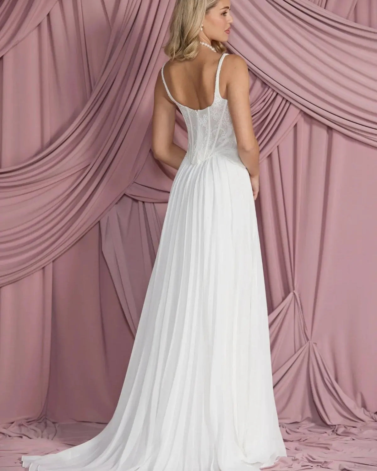 Back view of Larissa pleated chiffon bridal skirt in A-line silhouette, flowing elegantly from the waist.