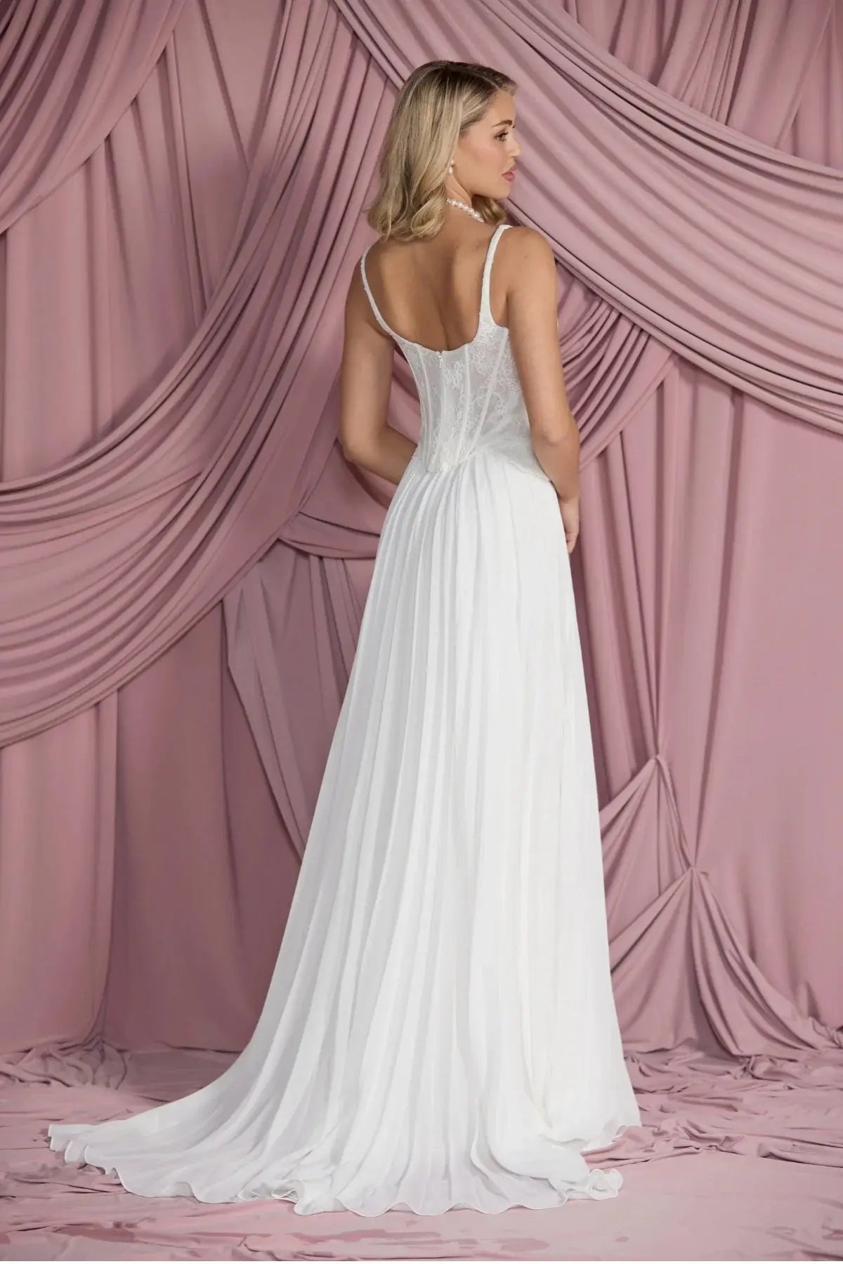Back view of Larissa pleated chiffon bridal skirt in A-line silhouette, flowing elegantly from the waist.