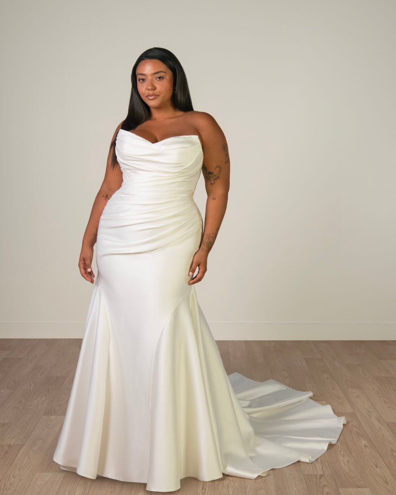 Sy8346 plus size wedding dress from stella york with a strapless neckline, rouched bodice and mermaid skirt.
