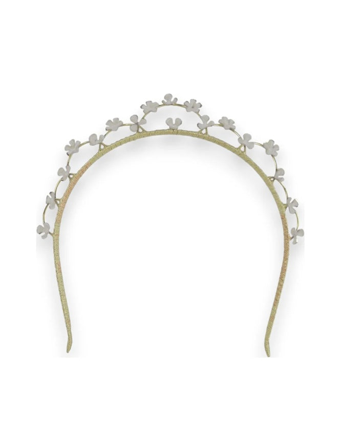 Gold headband with floral decorations for bride on wedding day.