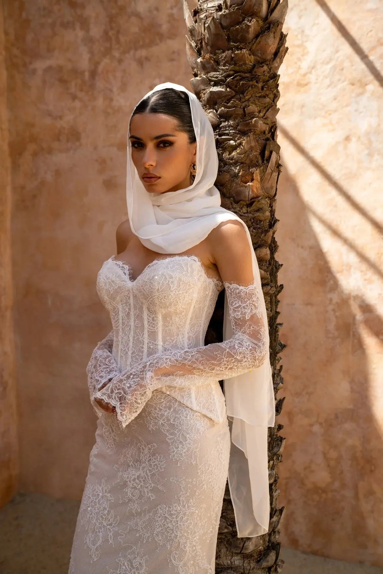 Amani two-piece lace bridal gown with mesh corset top, sweetheart neckline and fit-and-flare lace skirt.
