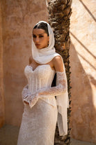 Amani two-piece lace bridal gown with mesh corset top, sweetheart neckline and fit-and-flare lace skirt.