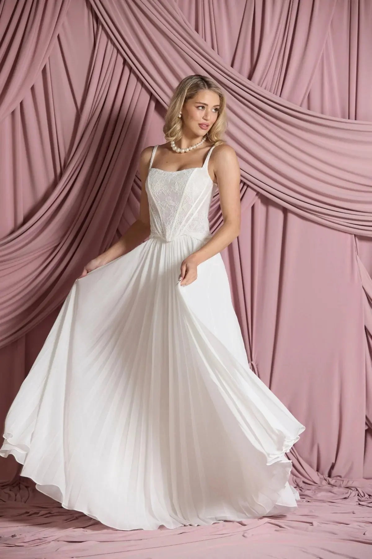 Front view of Larissa pleated chiffon bridal skirt in A-line silhouette, flowing gracefully from the waist.