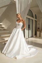 Princess style wedding dress with beaded bodice, full skirt and pockets