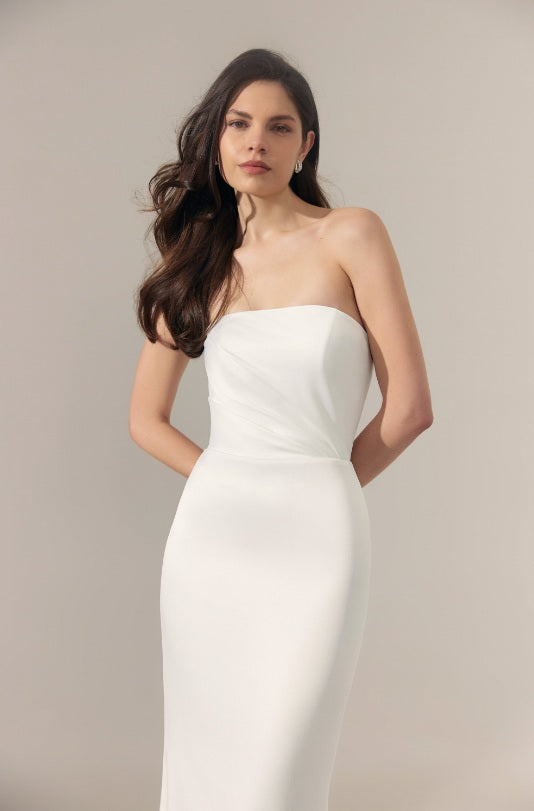 Strapless ivory satin wedding dress with straight across neckline.