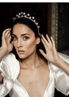 Woman wearing a bridal tiara with floral design.