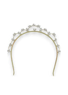 Gold headband with floral decorations for bride on wedding day.