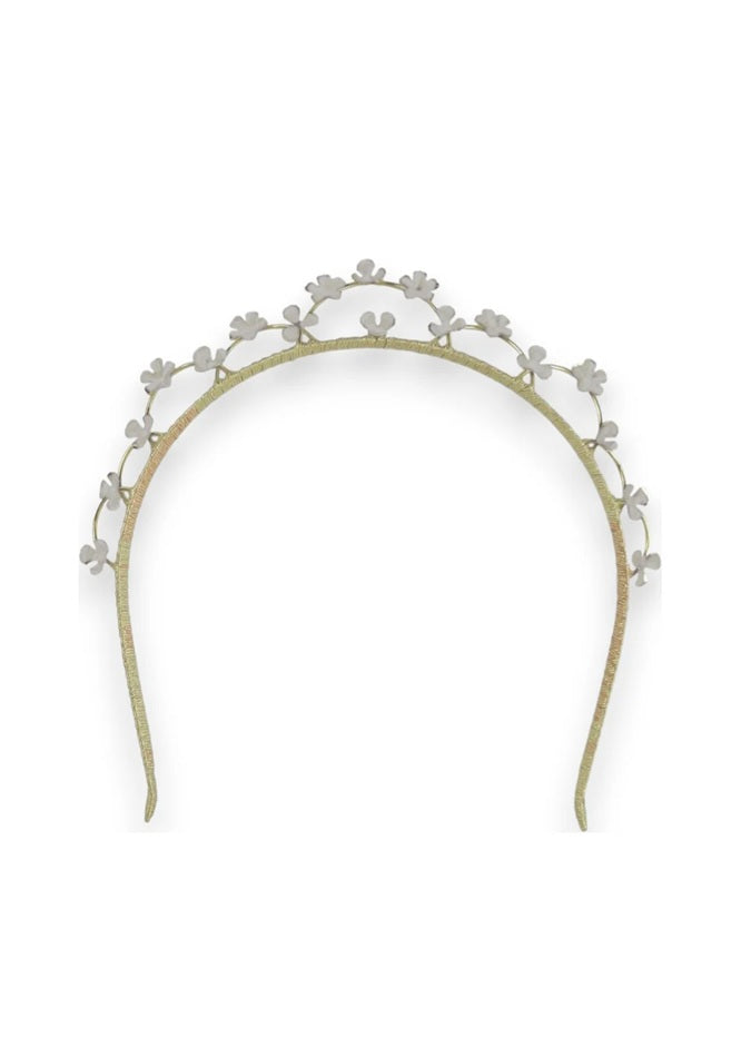 Gold headband with floral decorations for bride on wedding day.